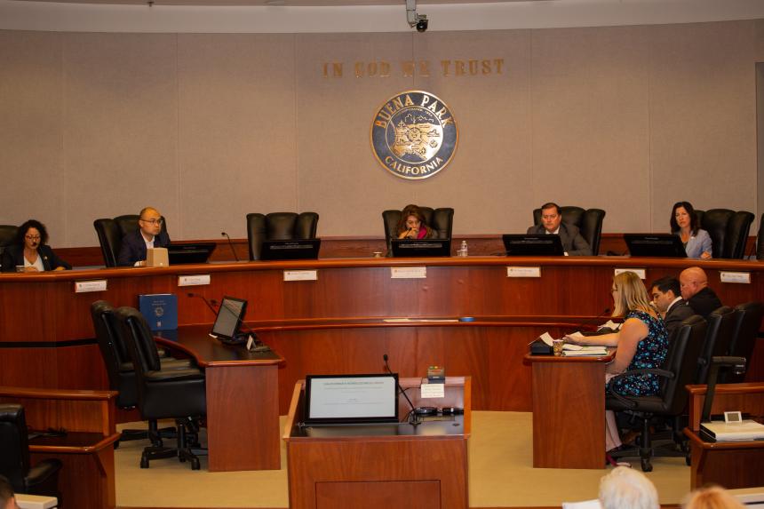 Chronic Homelessness Hearing Select Committee gather at the dais to discussion solutions  