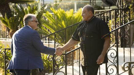 Congressman Lou Correa shakes hands with the president of CSUF